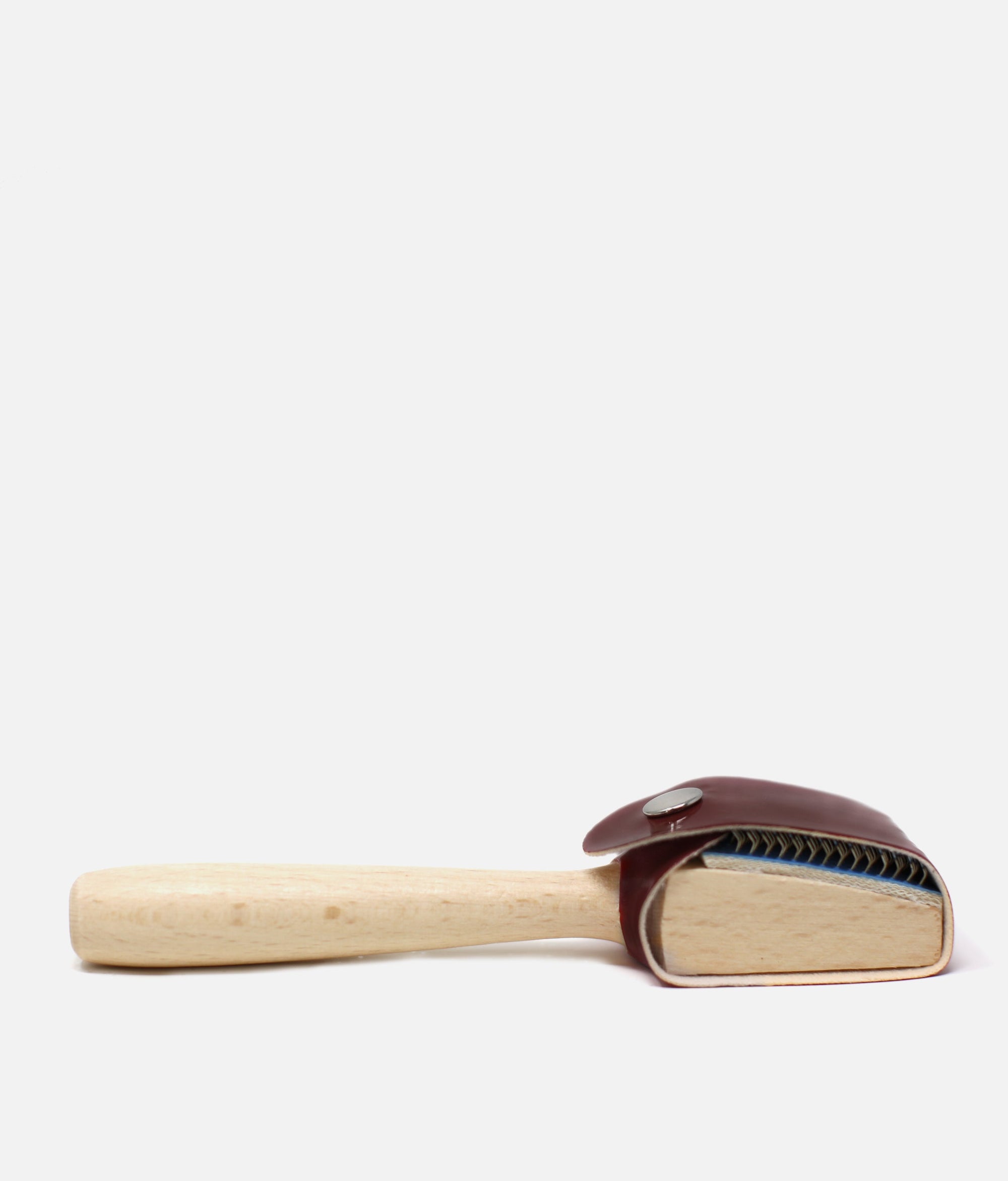 Cleaning brush with wooden handle and leather bristle head on a white   background  #brown_one