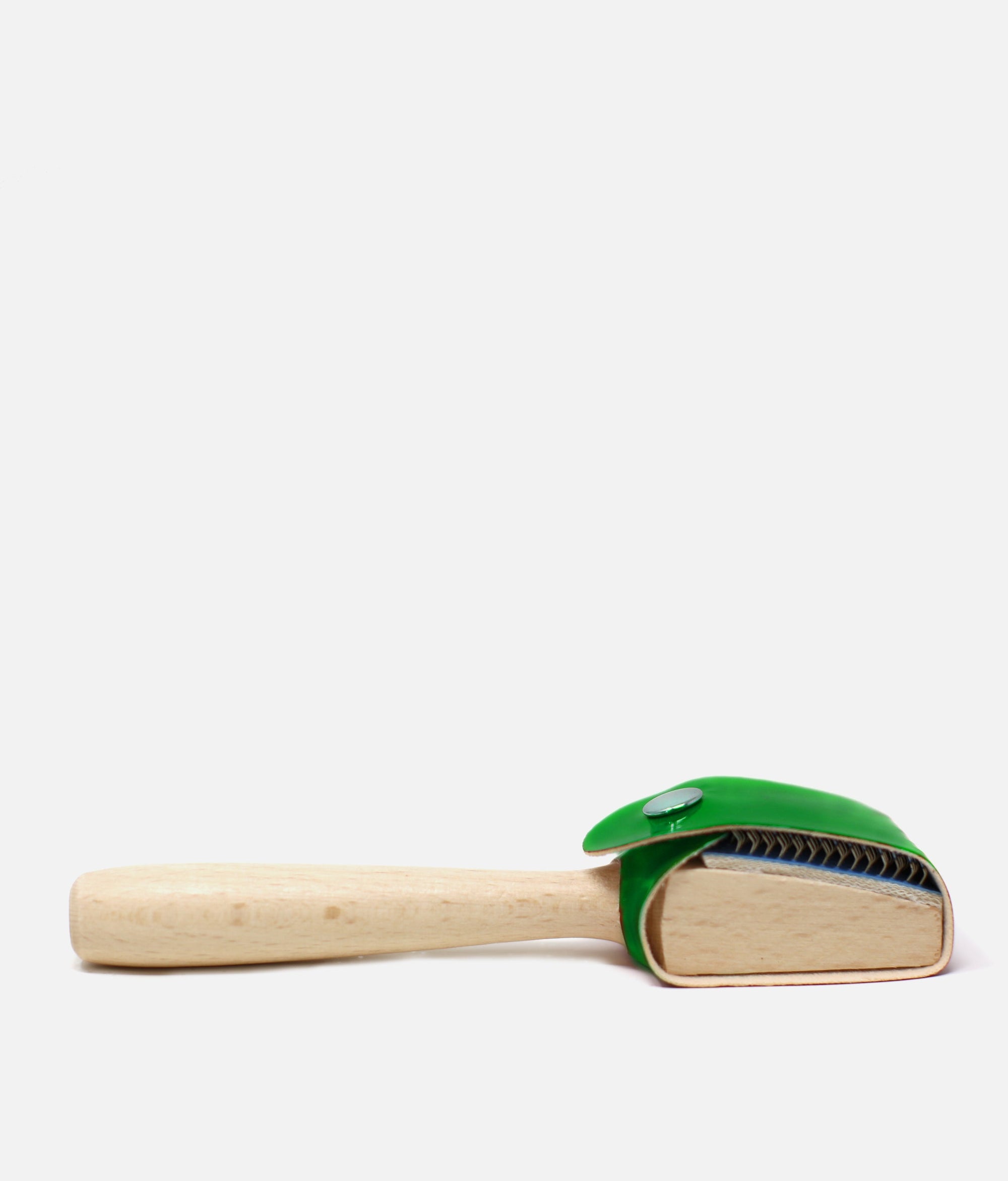 Cleaning brush with green bristle head and wooden handle on a white background  #green_one